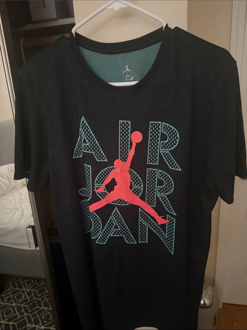 Nike Black T‑Shirt with Teal Text and Red Jumpman